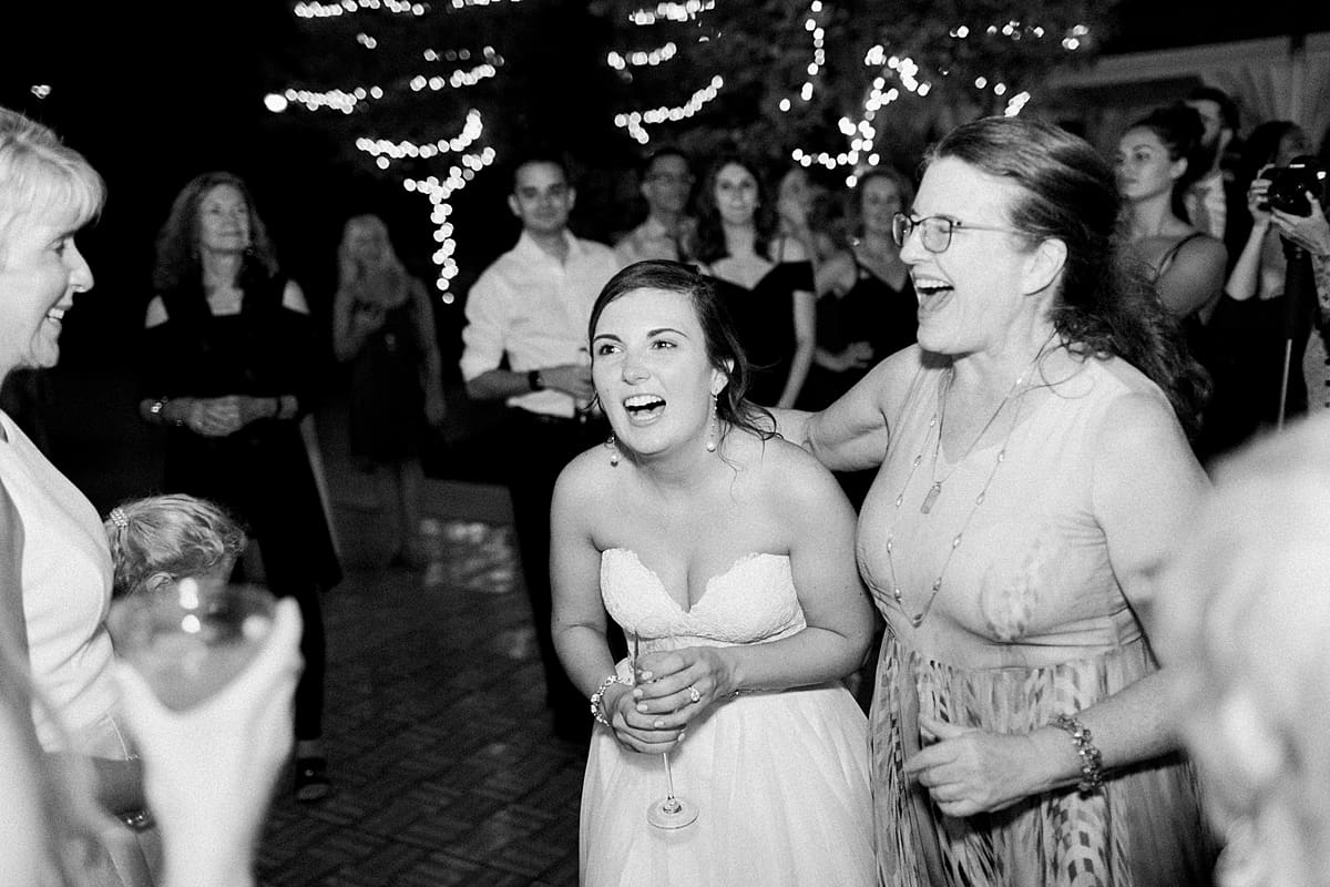 Arielle Peters Photography | Bride laughing at wedding reception at The Bridgewater Club in Carmel, Indiana on wedding day.