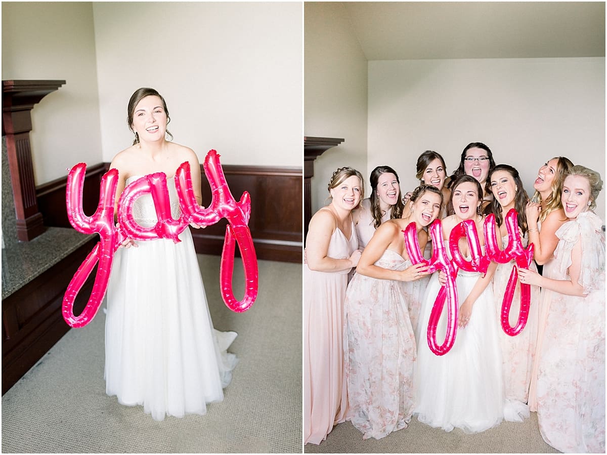 Arielle Peters Photography | Bride and bridesmaids holding Yay balloon at The Bridgewater Club in Carmel, Indiana on wedding day.