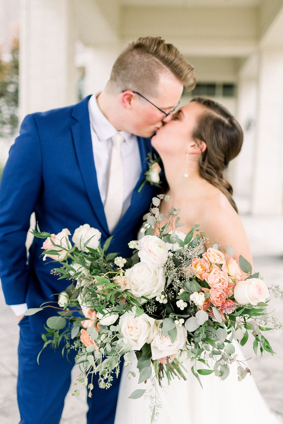 Arielle Peters Photography | Bride and groom kissing outside at The Bridgewater Club in Carmel, Indiana on wedding day.