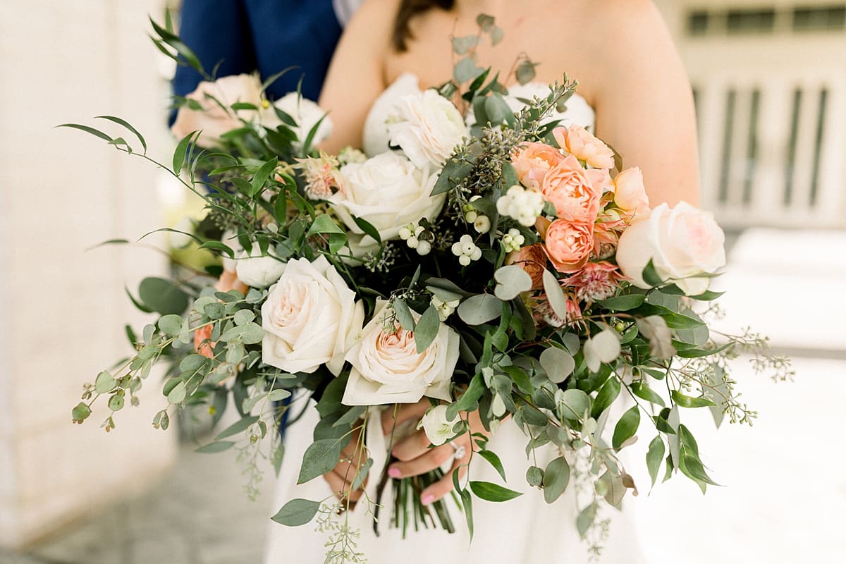 Arielle Peters Photography | Bride holding wedding bouquet outside at The Bridgewater Club in Carmel, Indiana on wedding day.