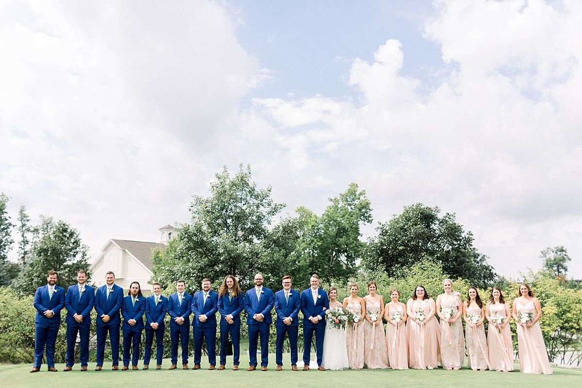 Arielle Peters Photography | Bride and groom and wedding party lined up outside at The Bridgewater Club in Carmel, Indiana on wedding day.