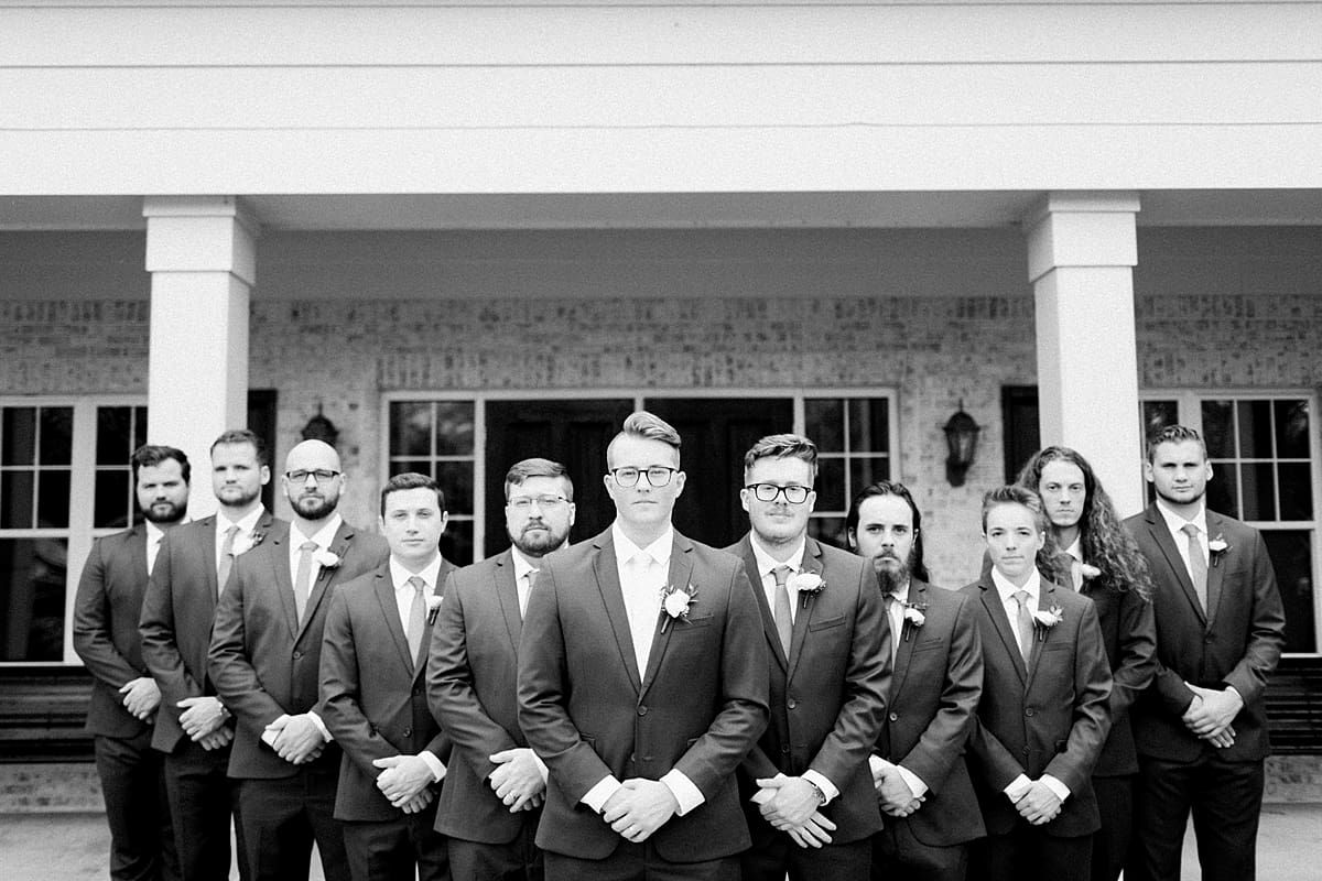 Arielle Peters Photography | Groom and groomsmen with serious faces outside at The Bridgewater Club in Carmel, Indiana on wedding day.