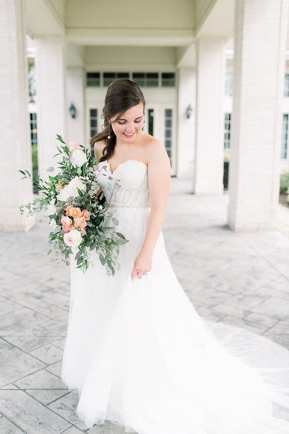 Arielle Peters Photography | Bride dancing in her gown outside at The Bridgewater Club in Carmel, Indiana on wedding day.