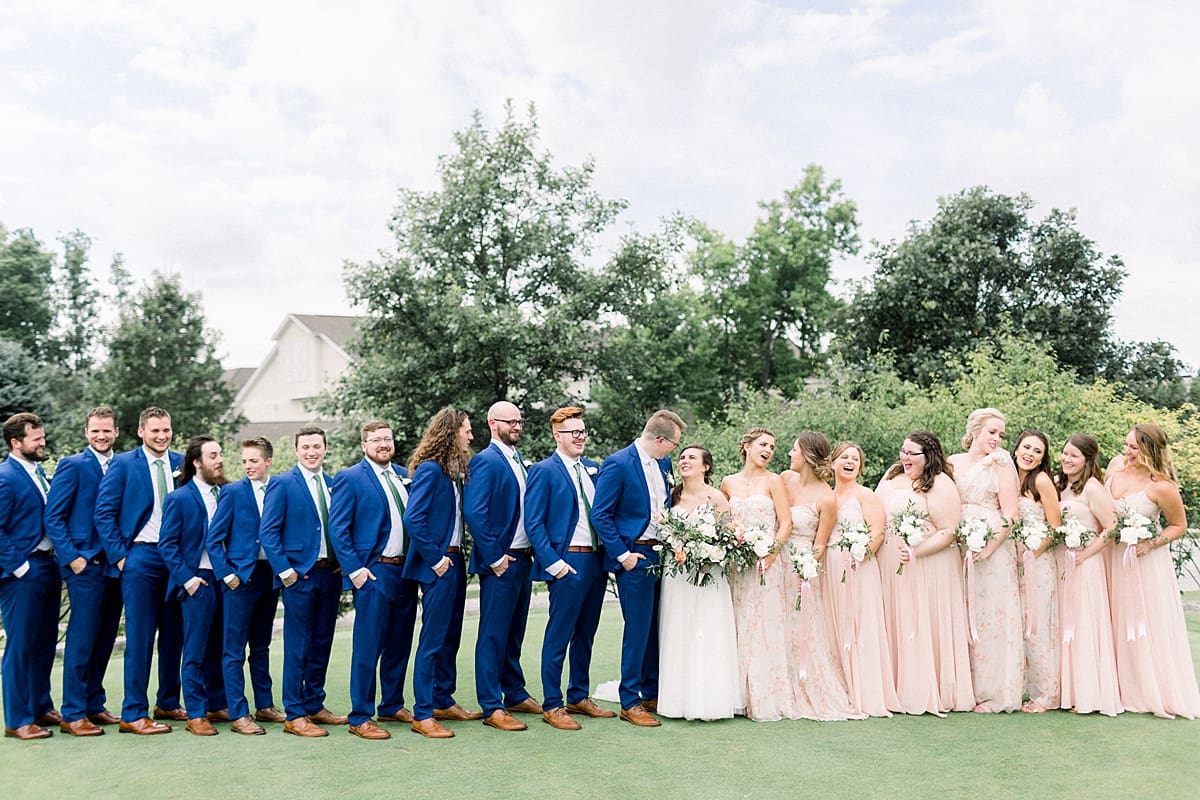 Arielle Peters Photography | Wedding party smiling outside at The Bridgewater Club in Carmel, Indiana on wedding day.