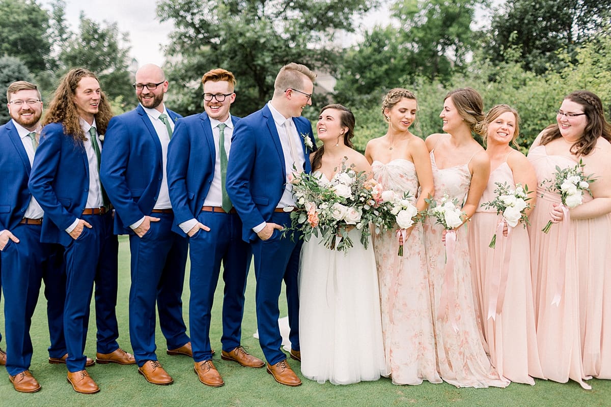 Arielle Peters Photography | Wedding party smiling outside at The Bridgewater Club in Carmel, Indiana on wedding day.