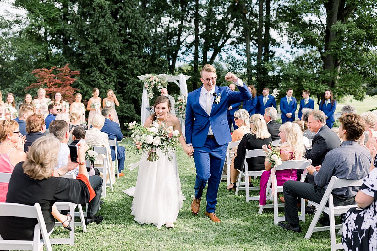 Arielle Peters Photography | Bride and groom walking down the aisle at The Bridgewater Club in Carmel, Indiana on wedding day.