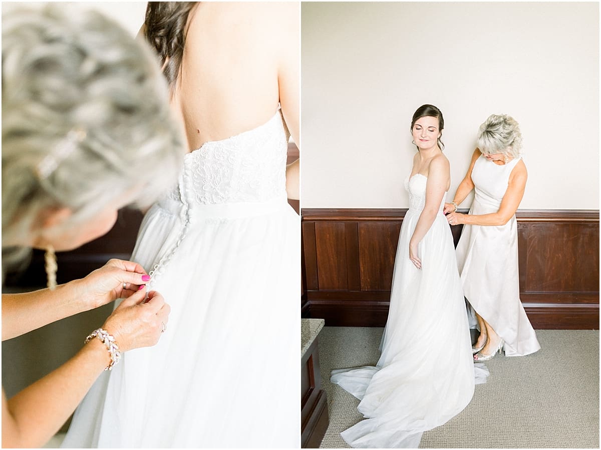 Arielle Peters Photography | Mother of the bride helping the bride put on her dress at The Bridgewater Club in Carmel, Indiana on wedding day.