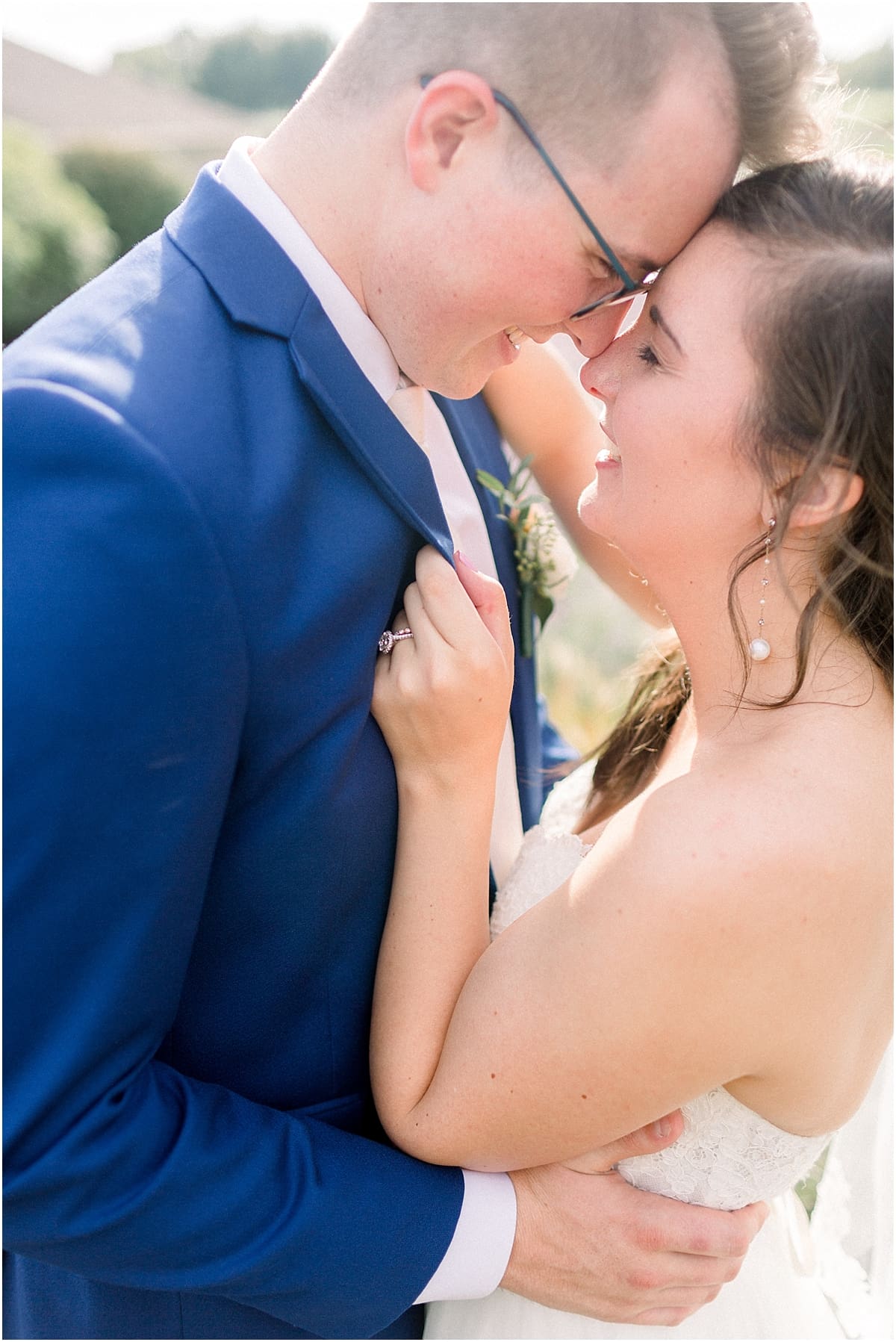 Arielle Peters Photography | Bride and groom smiling in a lavender field at The Bridgewater Club in Carmel, Indiana on wedding day.