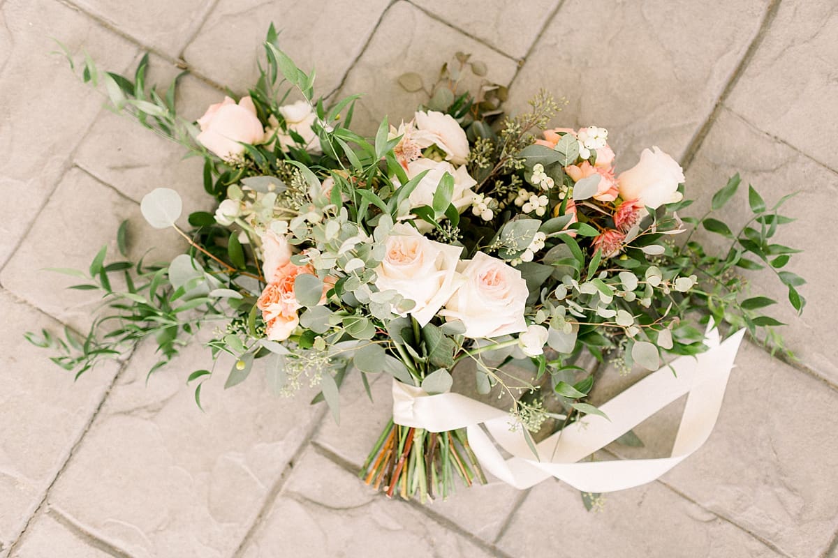 Arielle Peters Photography | Bridal bouquet and ribbon at The Bridgewater Club in Carmel, Indiana on wedding day.