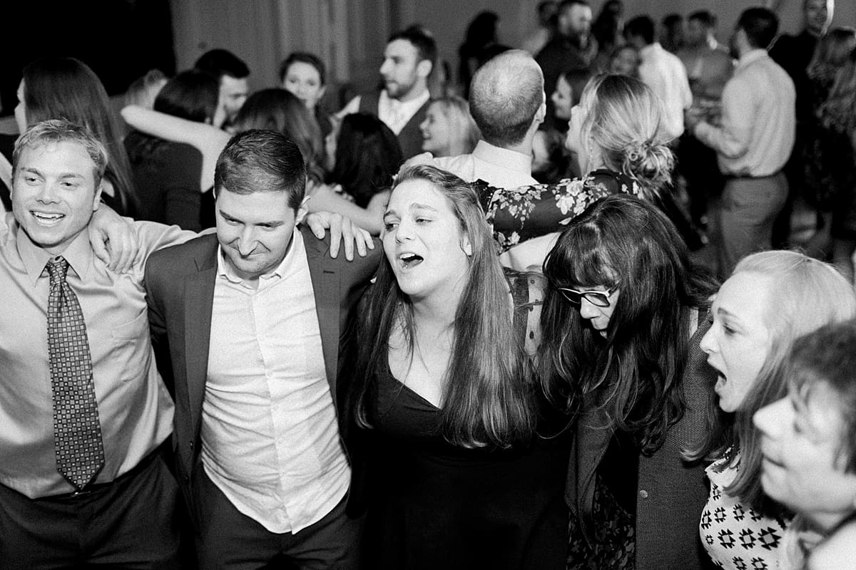 Arielle Peters Photography | Wedding guests singing and dancing at wedding reception at The Madison Club in Madison, Wisconsin.