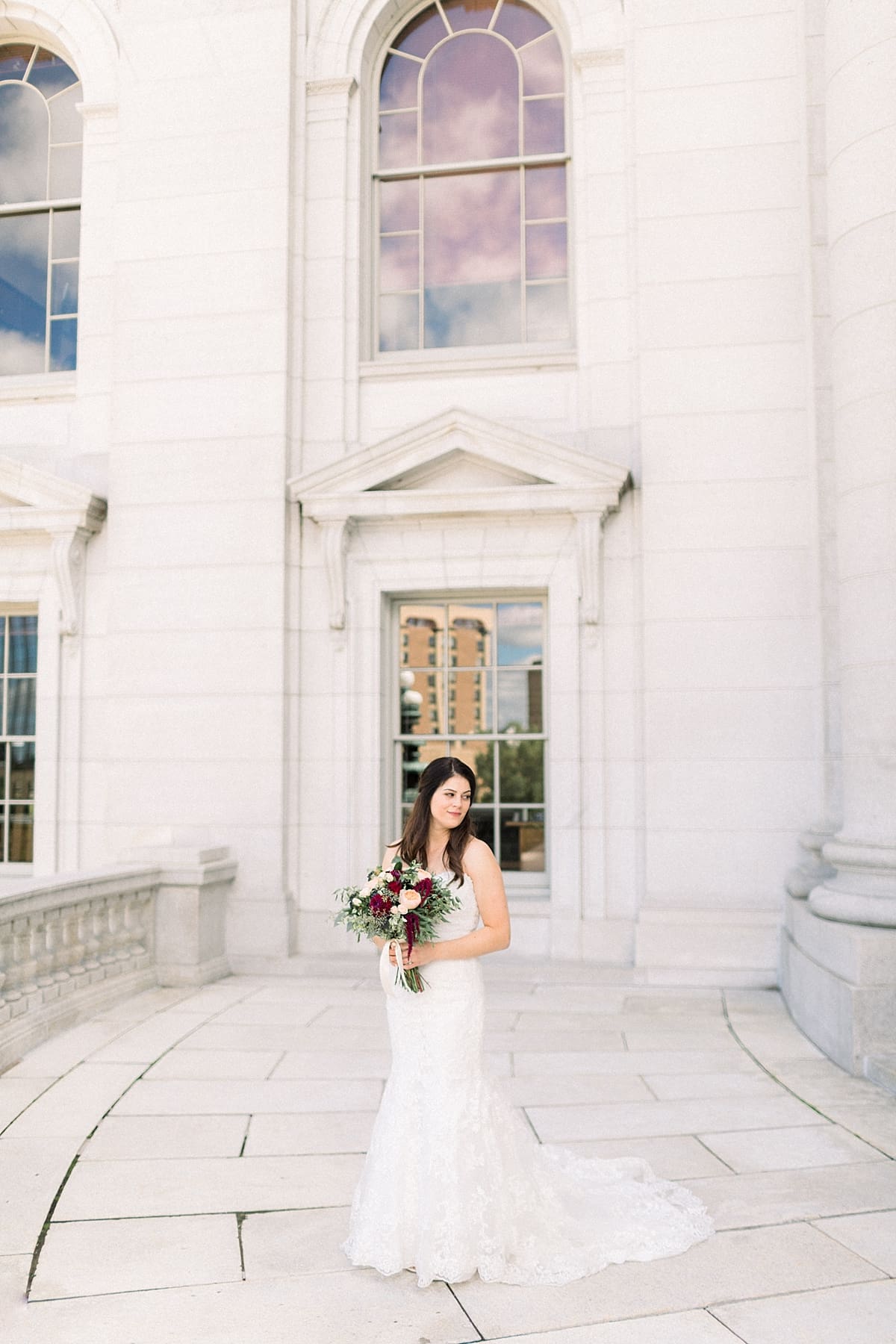 Arielle Peters Photography | Bride in her wedding dress in downtown Madison, Wisconsin on wedding day.