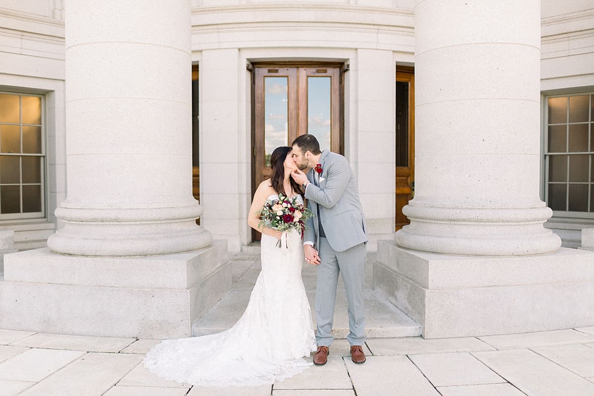 Arielle Peters Photography | Groom kissing bride on wedding day at Monona Terrace in Madison, Wisconsin.