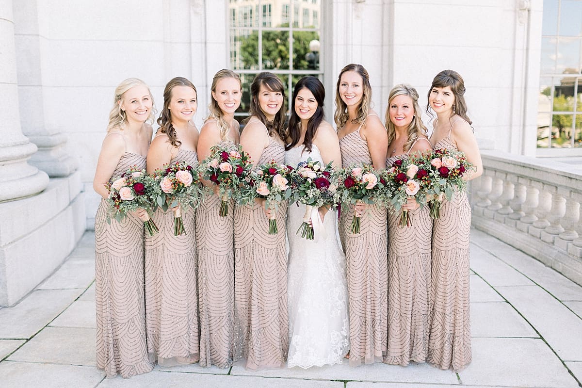 Arielle Peters Photography | Bride and bridesmaids smiling with bouquets on wedding day at Monona Terrace in Madison, Wisconsin.