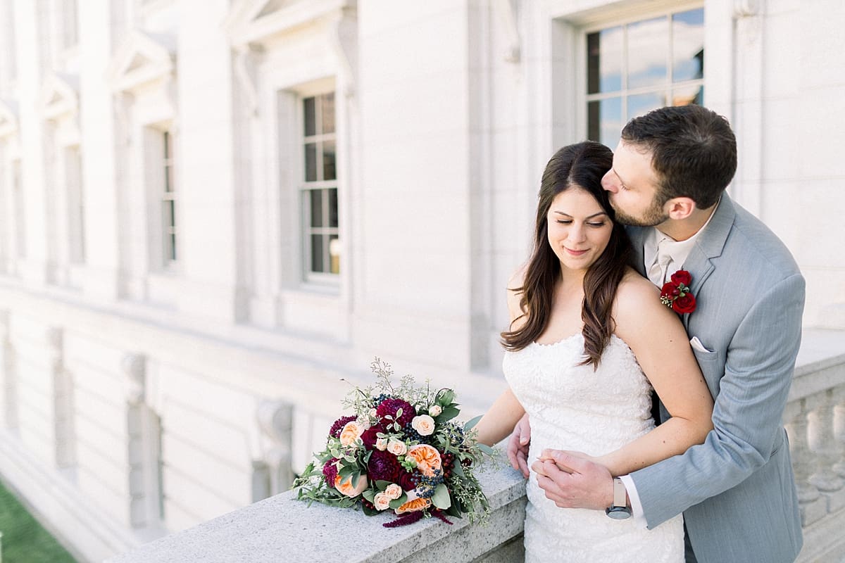 Arielle Peters Photography | Groom kissing the bride's forehead on wedding day at Monona Terrace in Madison, Wisconsin.