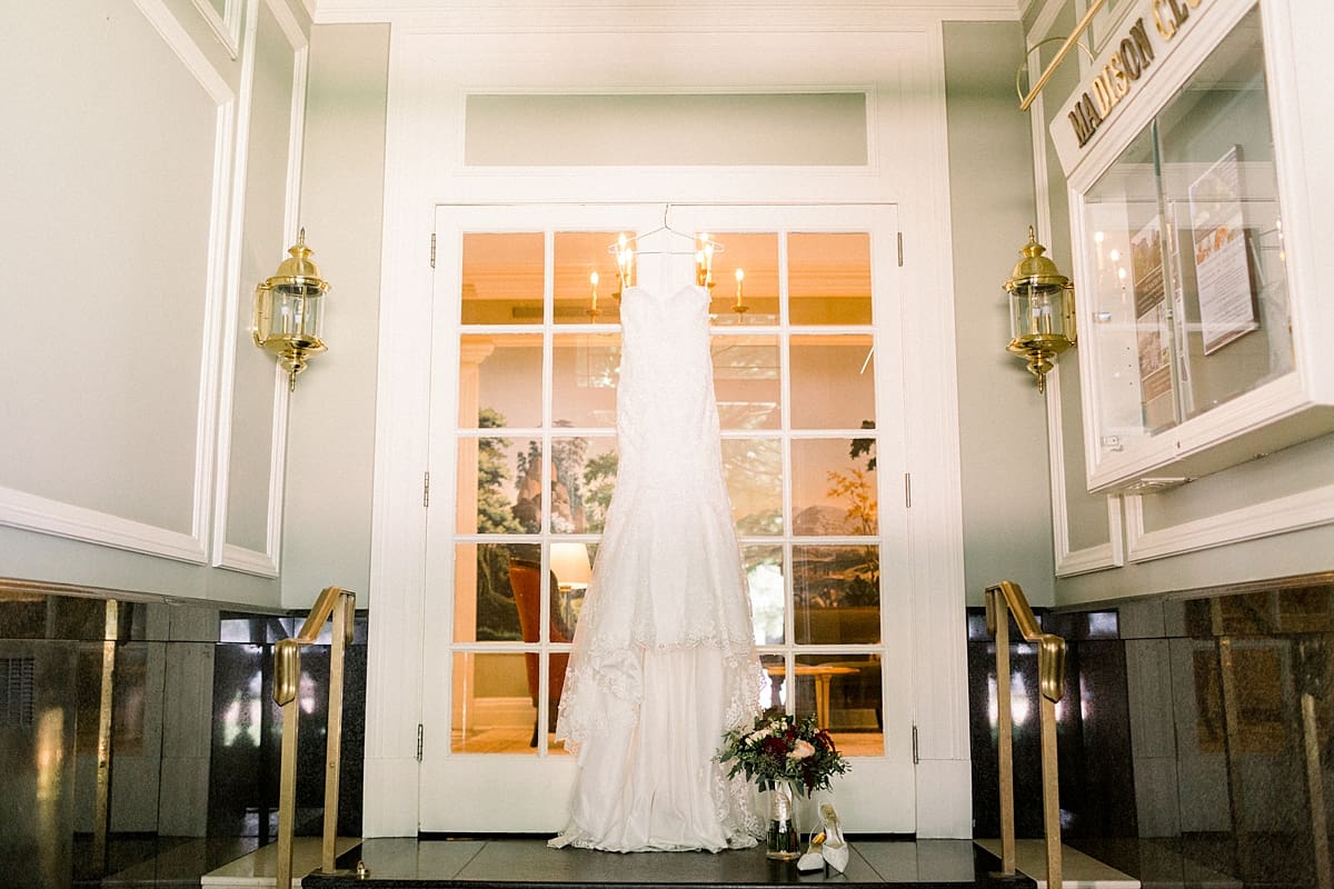 Arielle Peters Photography | Wedding dress hanging in door way on wedding day in Madison, Wisconsin.