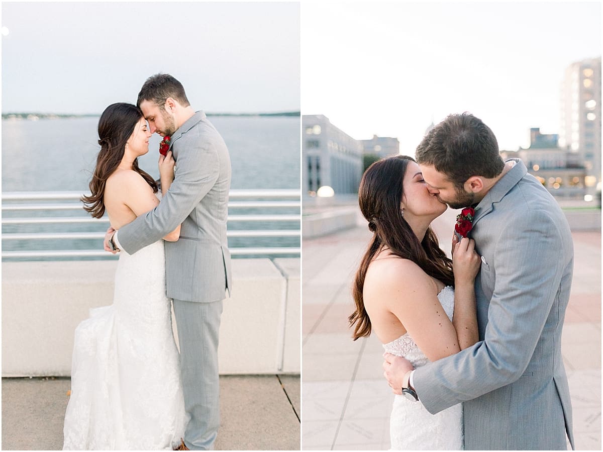 Arielle Peters Photography | Groom holding bride in her arms by the water in Madison, Wisconsin on wedding day.