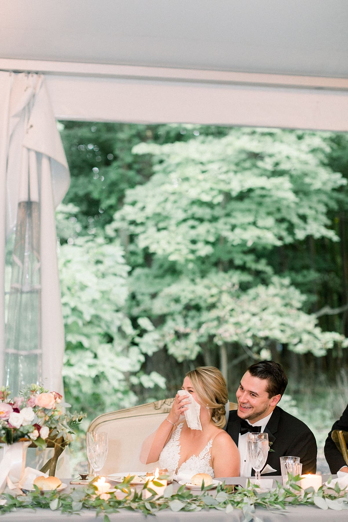 Arielle Peters Photography | Bride and groom laughing during speeches at wedding reception at The Morris Estate in Niles, Michigan on wedding day.  