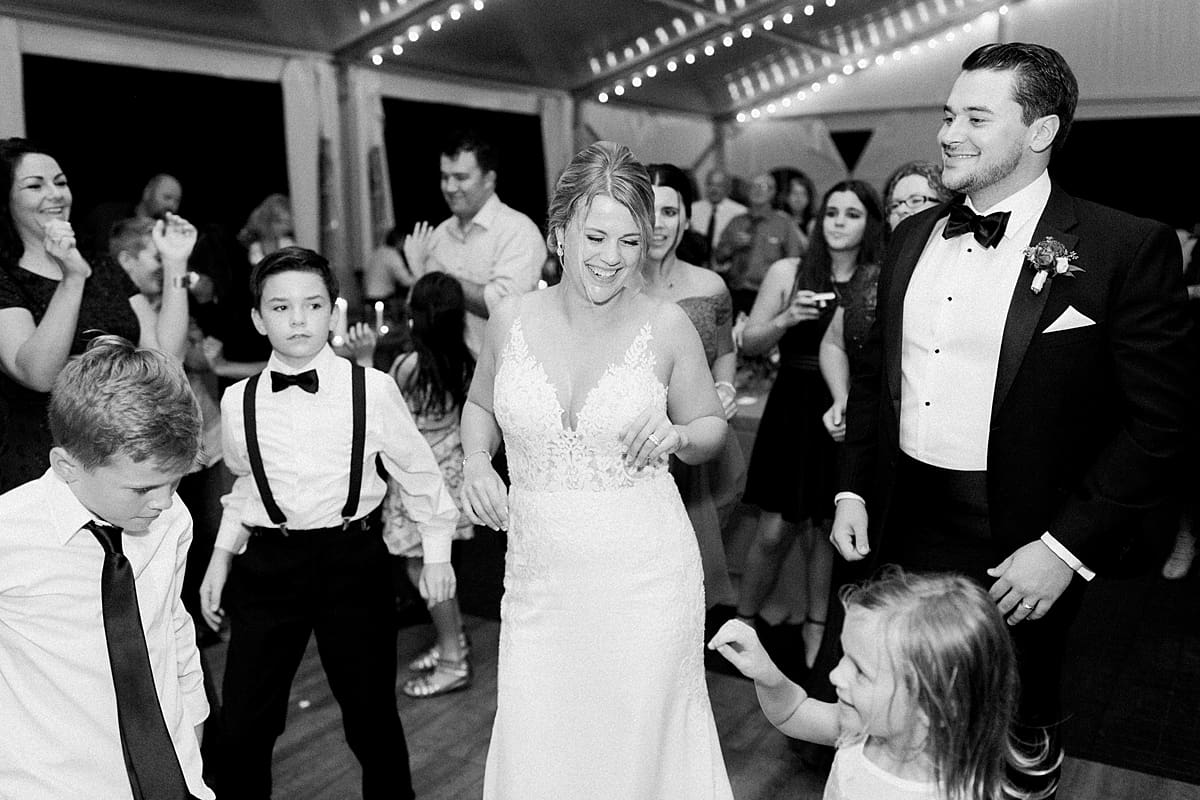 Arielle Peters Photography | Bride and groom dancing with wedding guests at wedding reception at The Morris Estate in Niles, Michigan on wedding day.  