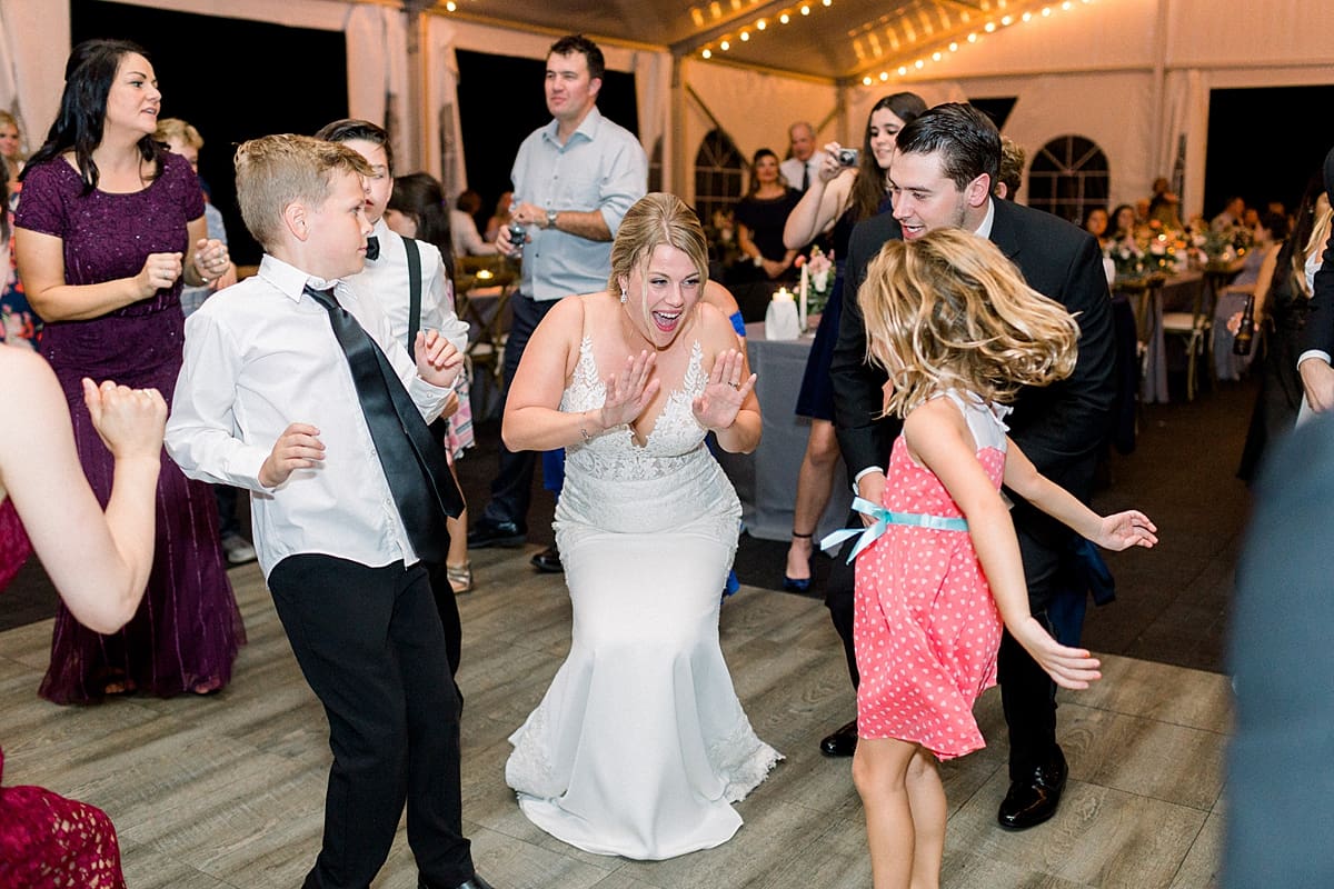 Arielle Peters Photography | Bride and groom dancing with wedding guests at wedding reception at The Morris Estate in Niles, Michigan on wedding day.  