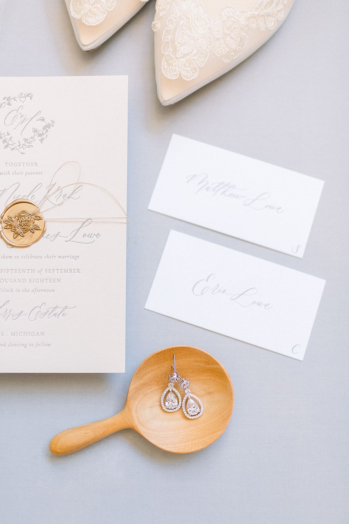 Arielle Peters Photography | Wedding jewelry and invitations at The Morris Estate in Niles, Michigan on wedding day. 