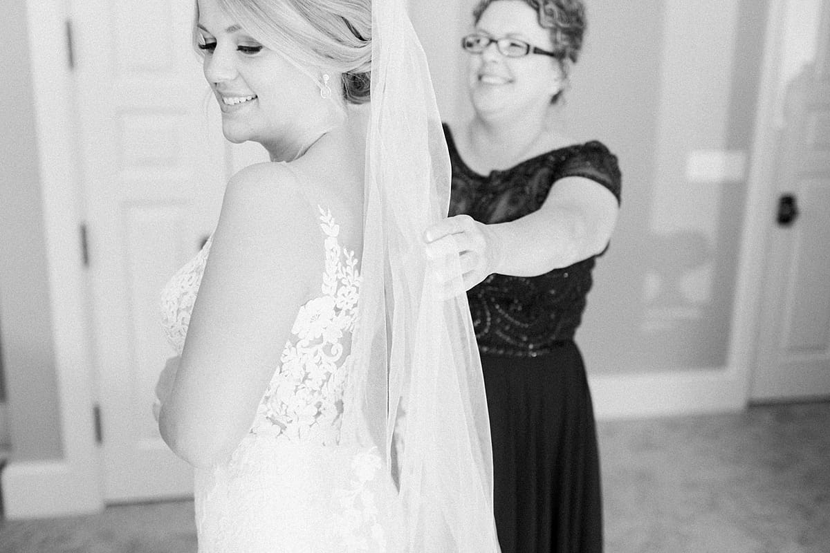 Arielle Peters Photography | Mother of the bride adjusting the bride's veil at The Morris Estate in Niles, Michigan on wedding day. 