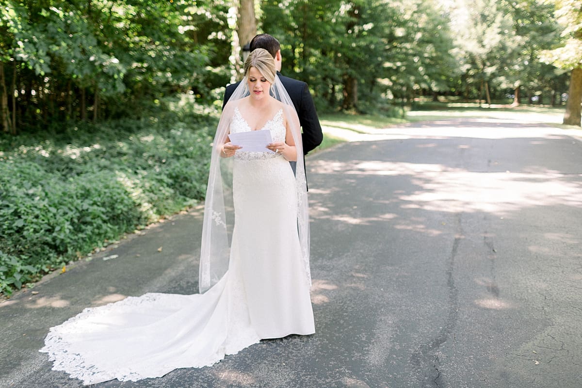 Arielle Peters Photography | Bride and groom reading letters to each other at The Morris Estate in Niles, Michigan on wedding day. 