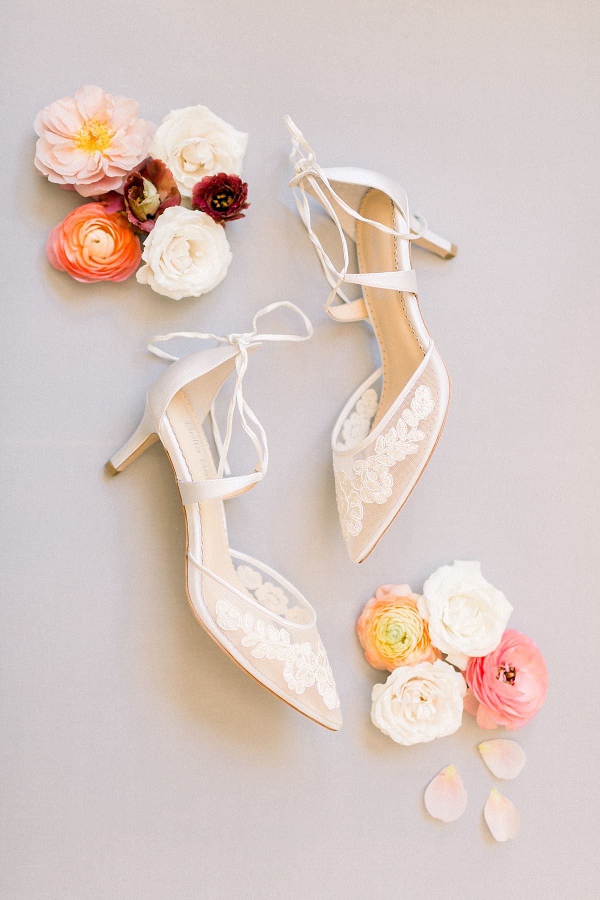 Arielle Peters Photography | Wedding shows lying next to roses at The Morris Estate in Niles, Michigan on wedding day. 