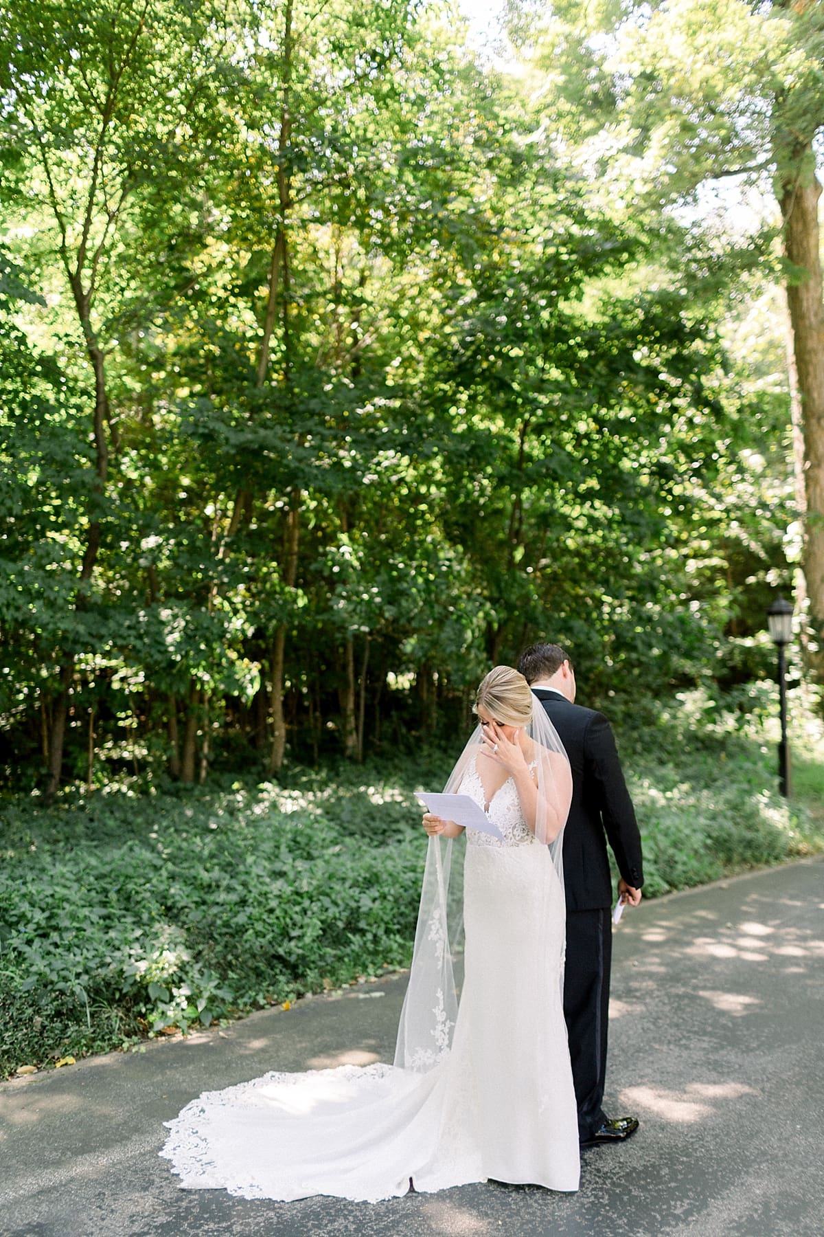 Arielle Peters Photography | Bride and groom reading letters to each other at The Morris Estate in Niles, Michigan on wedding day. 