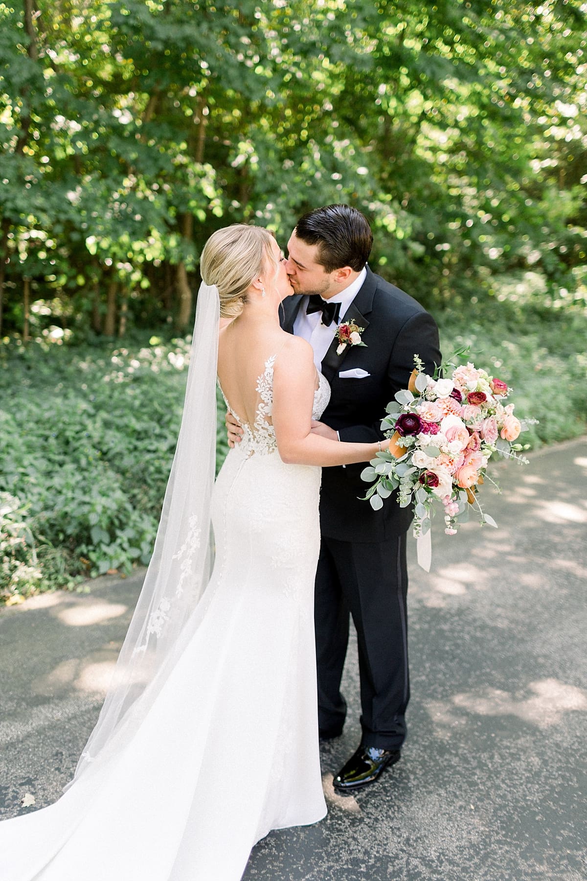 Arielle Peters Photography | Bride and groom kissing during first reveal at The Morris Estate in Niles, Michigan on wedding day. 