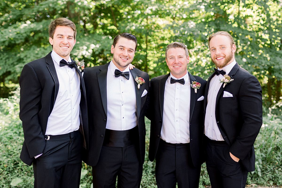 Arielle Peters Photography | Groom and groomsmen standing outside at The Morris Estate in Niles, Michigan on wedding day. 