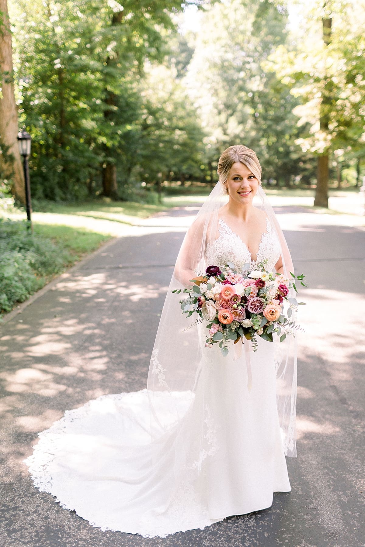 Arielle Peters Photography | Bride holding her bouquet outside at The Morris Estate in Niles, Michigan on wedding day. 