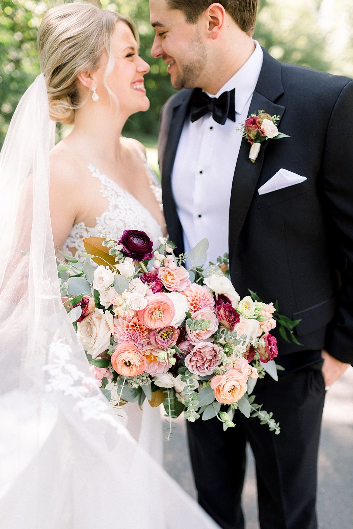 Arielle Peters Photography | Bride and groom smiling at each other outside at The Morris Estate in Niles, Michigan on wedding day. 