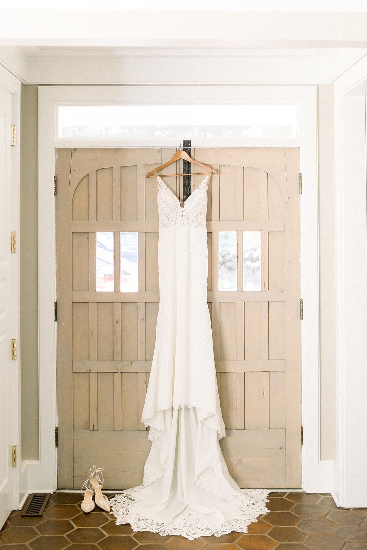 Arielle Peters Photography | Wedding dress hanging in doorway at The Morris Estate in Niles, Michigan on wedding day. 