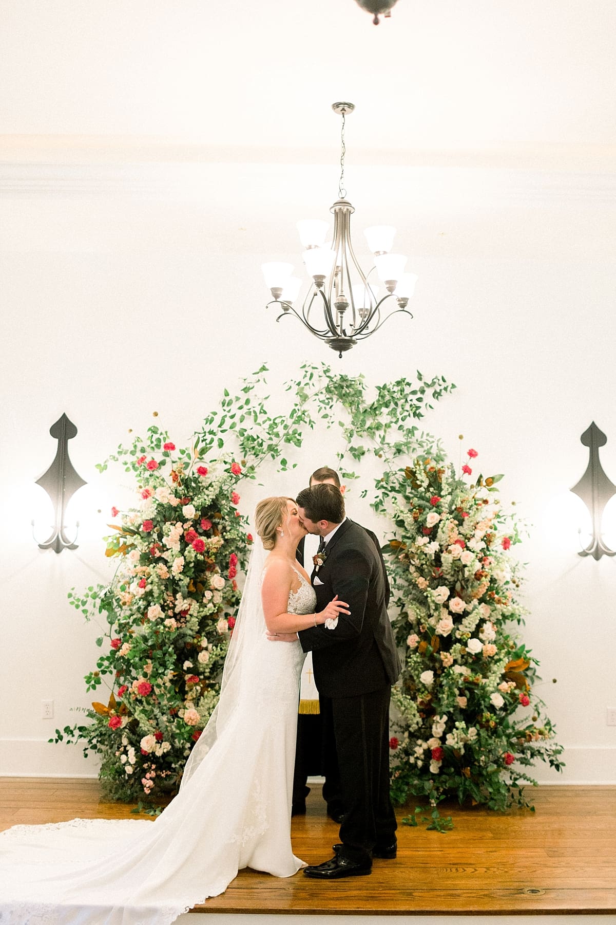Arielle Peters Photography | Bride and groom kissing at the alter at The Morris Estate in Niles, Michigan on wedding day. 