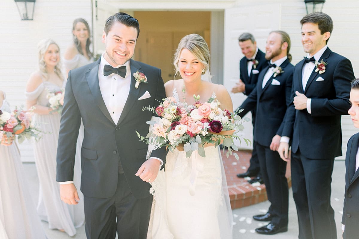 Arielle Peters Photography | Bride and groom walking out of the church at The Morris Estate in Niles, Michigan on wedding day. 