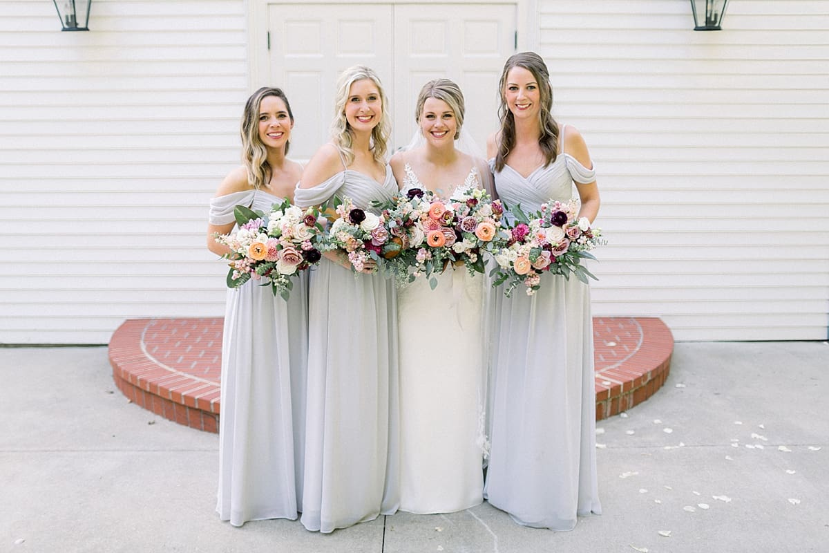 Arielle Peters Photography | Bride and bridesmaids outside the church at The Morris Estate in Niles, Michigan on wedding day. 