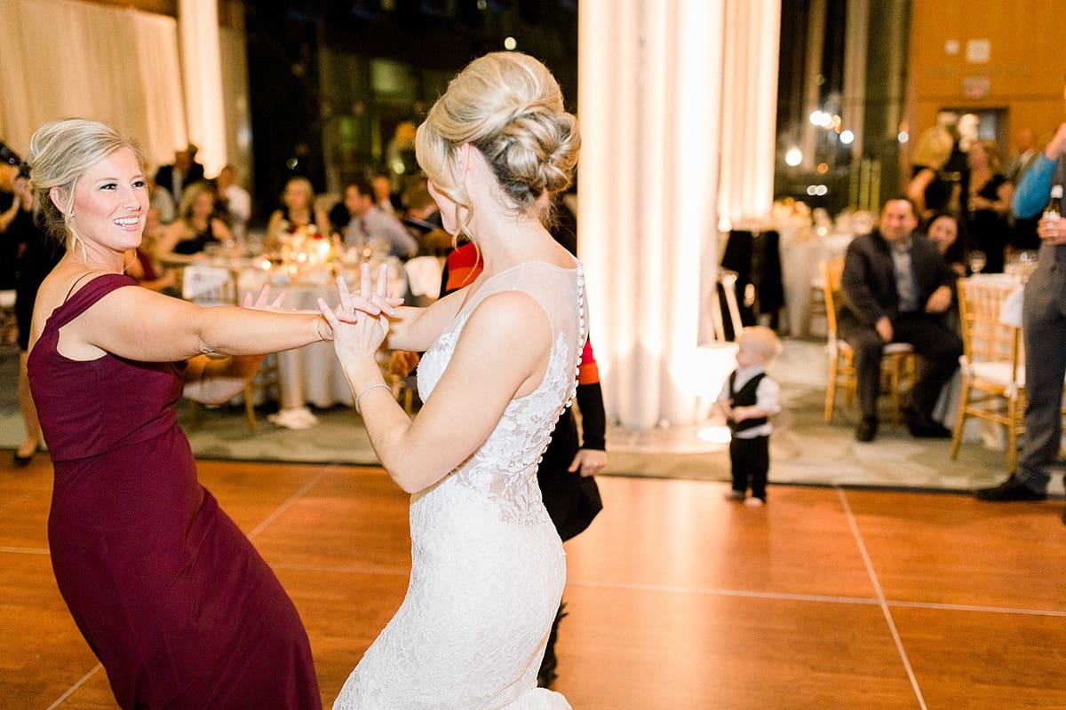 Arielle Peters Photography | Bride dancing with bridesmaids at wedding reception at Indy Public Library in Indianapolis.