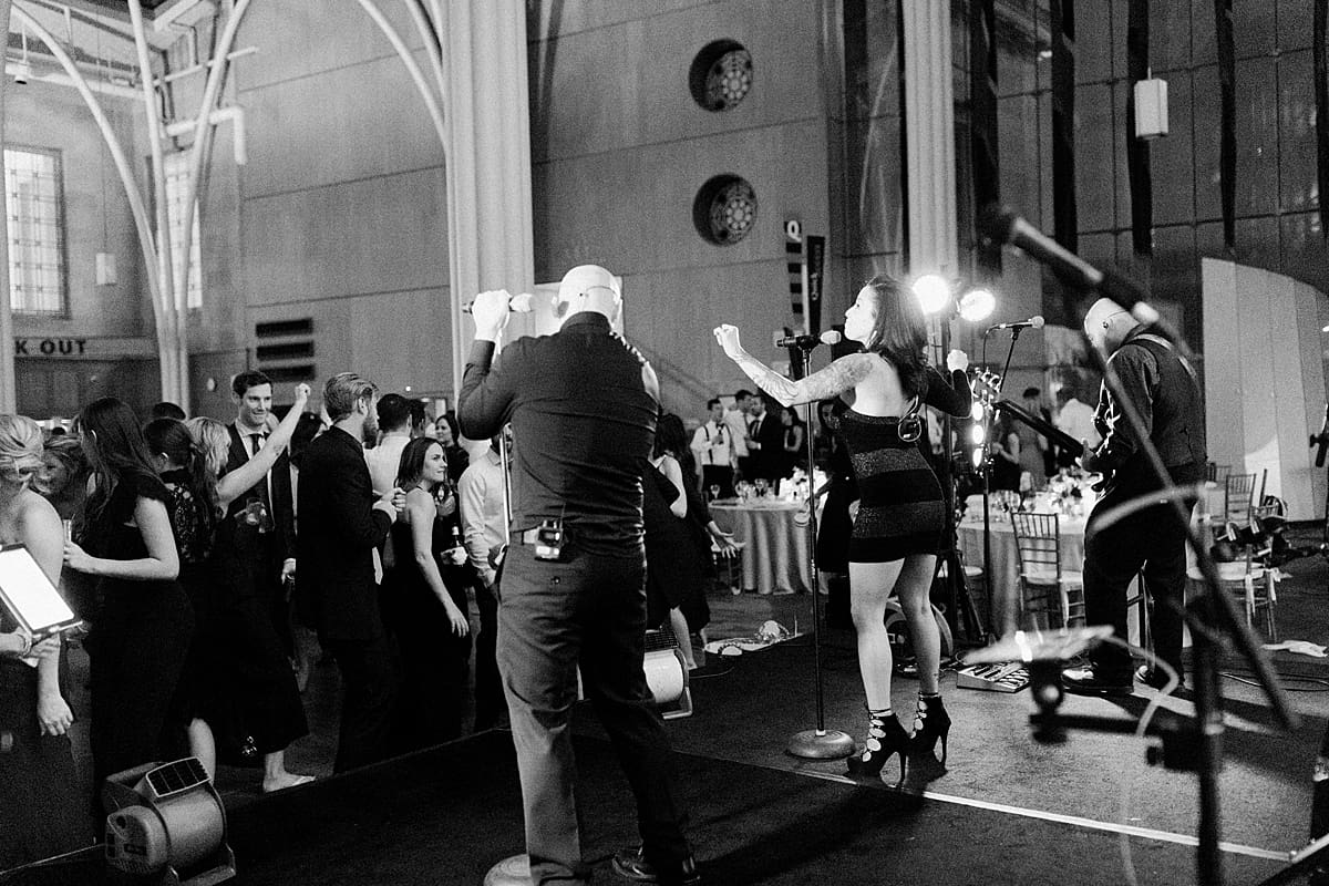 Arielle Peters Photography | Live wedding band singing and guests dancing at wedding reception at Indy Public Library in Indianapolis.