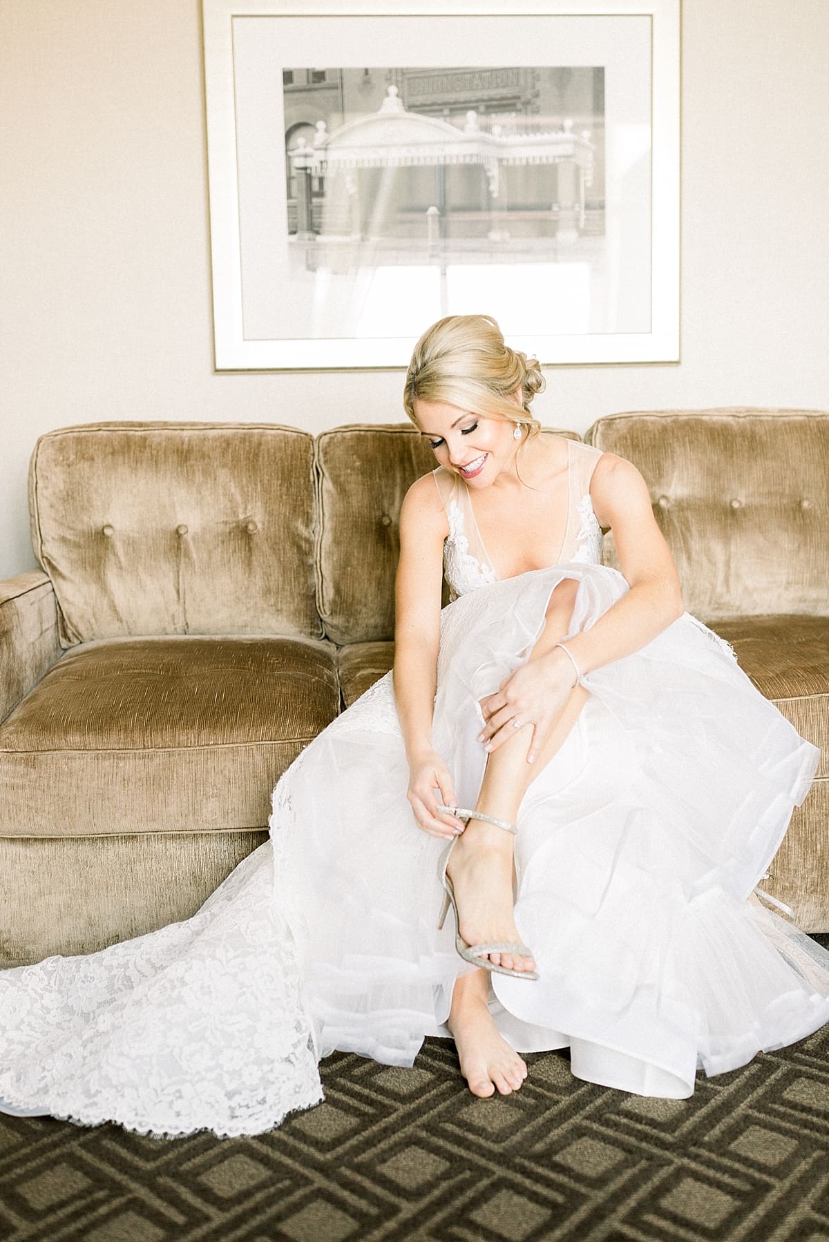 Arielle Peters Photography | Bride putting on her shoes while getting ready for her wedding day.