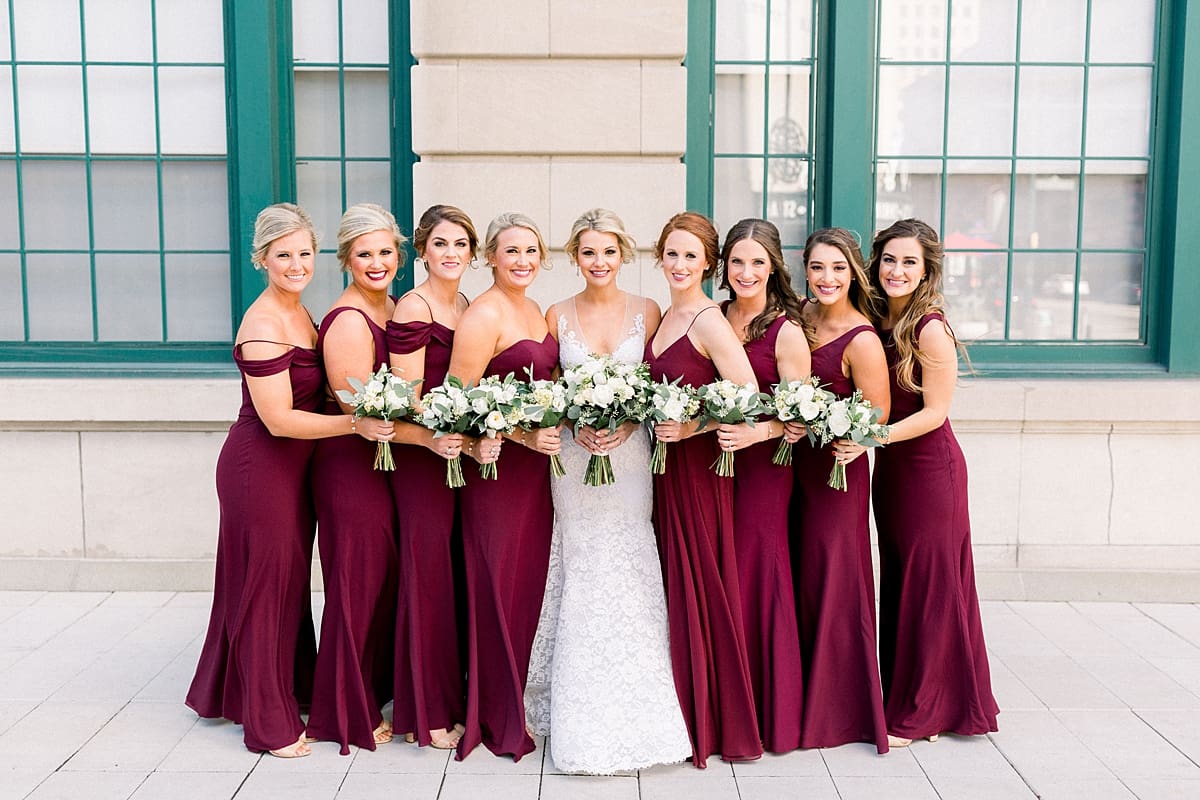 Arielle Peters Photography | Bride and bridesmaids smiling outside on wedding day in downtown Indianapolis. 