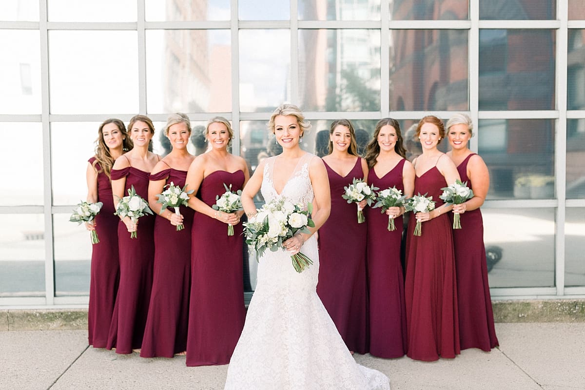 Arielle Peters Photography | Bride smiling with bridesmaids downtown Indianapolis on wedding day.