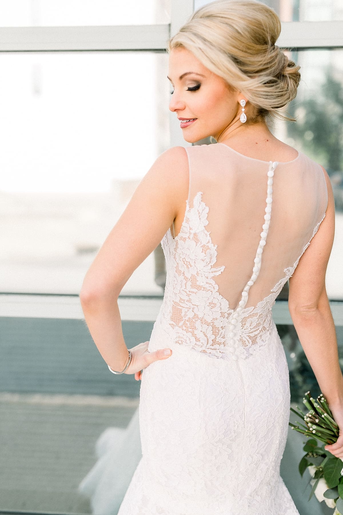 Arielle Peters Photography | Back detail of wedding dress on bride in Indianapolis on wedding day.