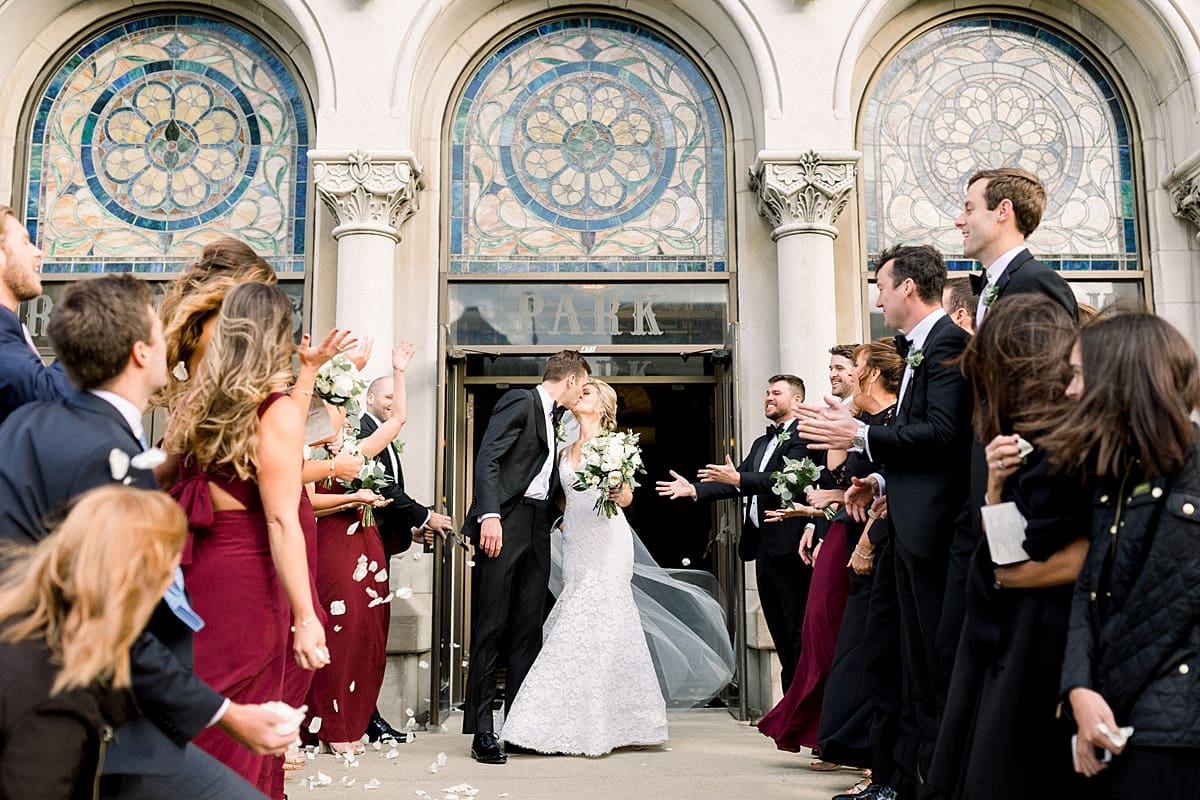Arielle Peters Photography | Bride and groom kissing outside of Roberts Park Church in Indianapolis on wedding day.