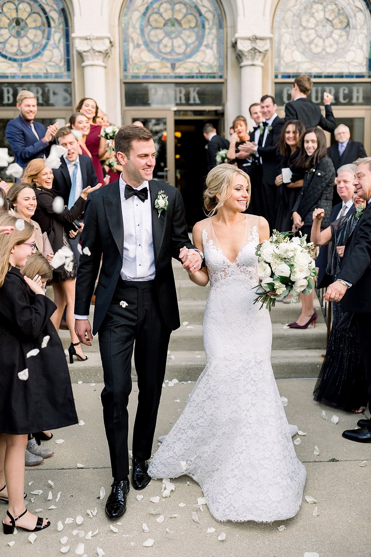 Arielle Peters Photography | Bride and groom walking outside Roberts Park Church in Indianapolis on wedding day.