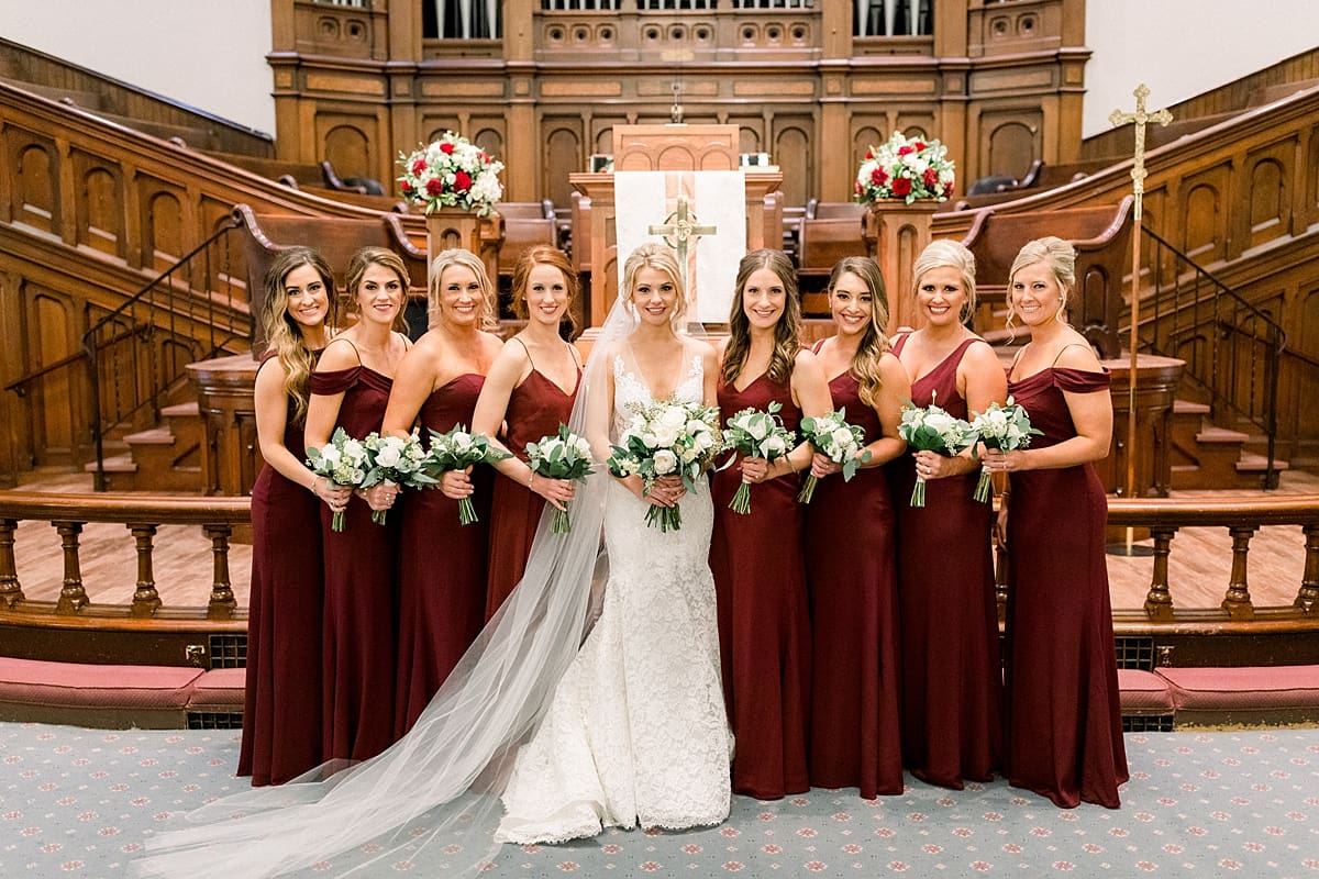 Arielle Peters Photography | Bride and bridesmaids smiling inside Roberts Park Church in Indianapolis on wedding day.
