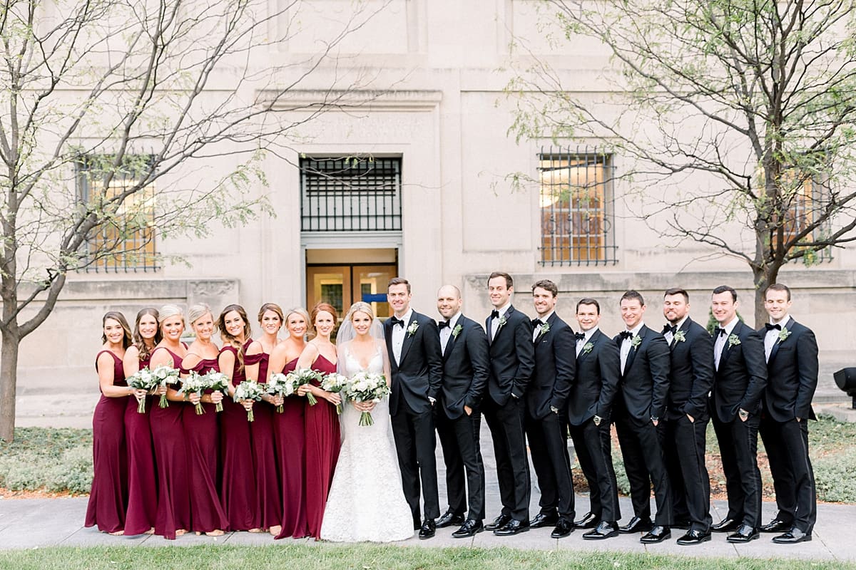Arielle Peters Photography | Bride and groom with the wedding party lined up in downtown Indianapolis on wedding day.