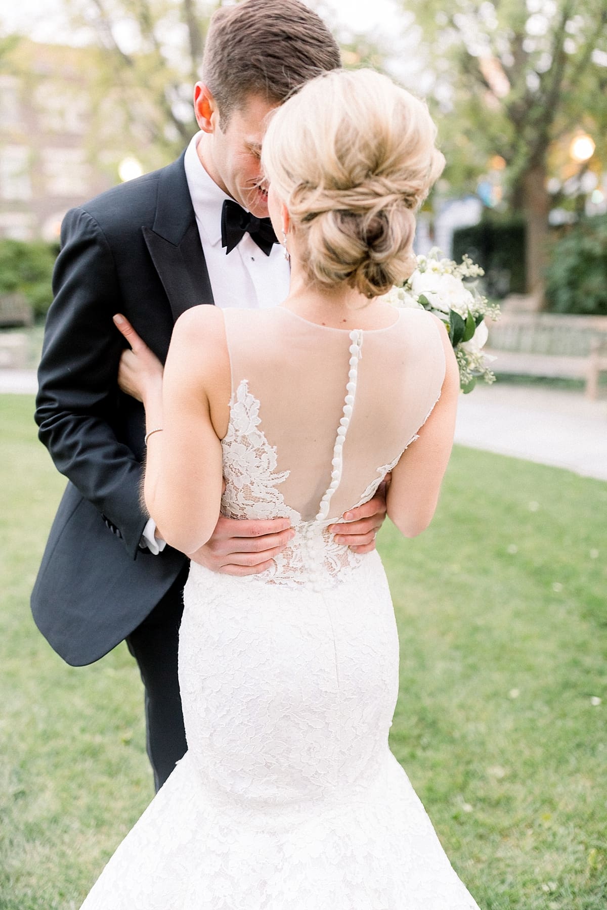Arielle Peters Photography | Groom holding his bride in Indianapolis on their wedding day.