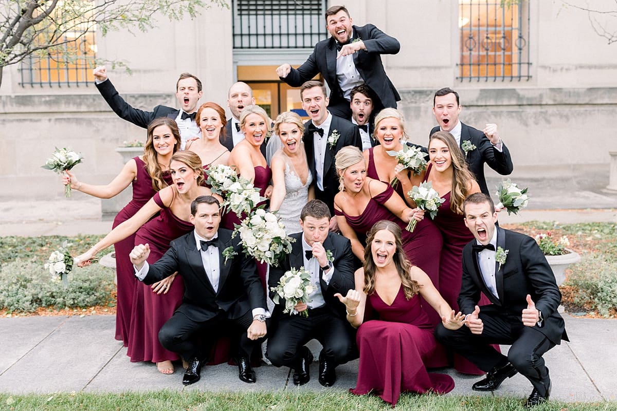 Arielle Peters Photography | Bride and groom and wedding party excited in downtown Indianapolis on wedding day.