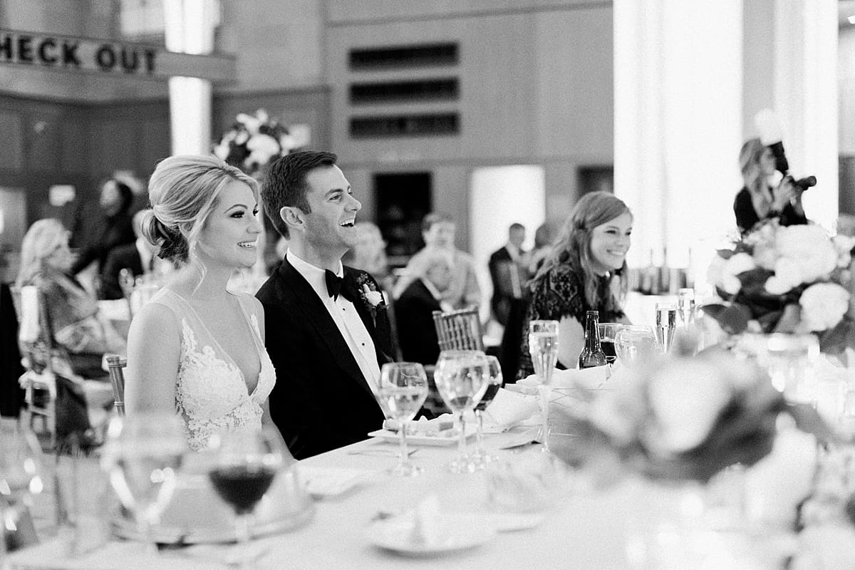Arielle Peters Photography | Bride and groom laughing during speeches at wedding reception at Indy Public Library in Indianapolis.