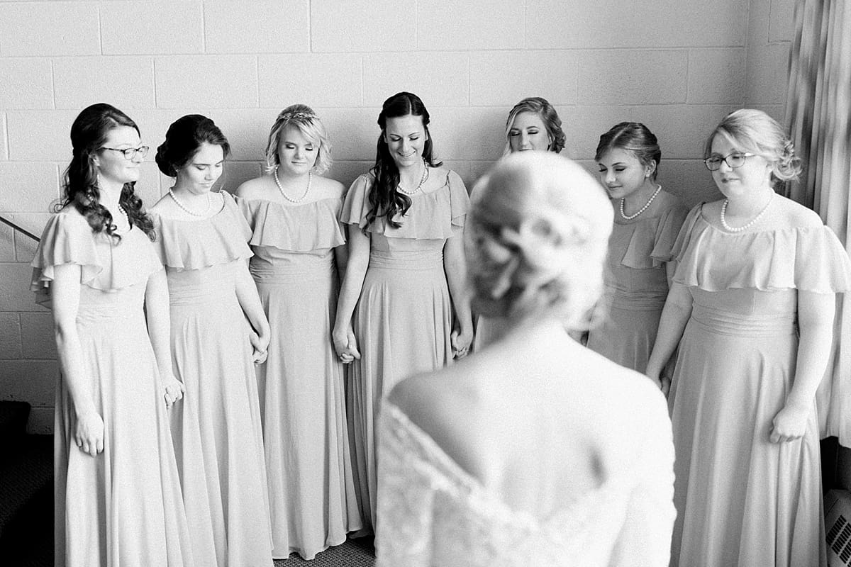 Arielle Peters Photography | Bridesmaids seeing the bride in her dress for the first time on fall wedding day.
